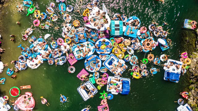 people floating down the river on tubes